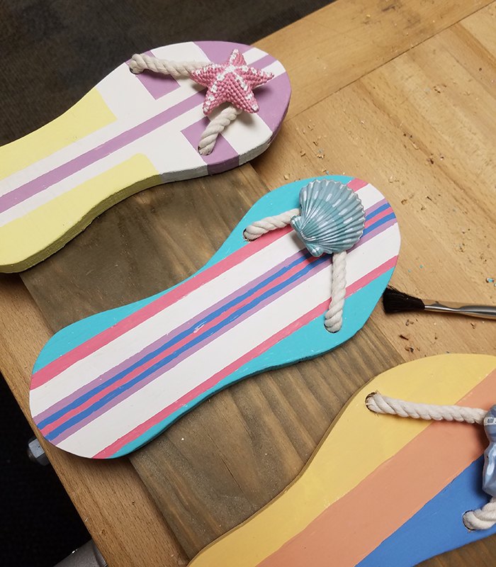 flip flop towel holder, Straps and seashells complete the look
