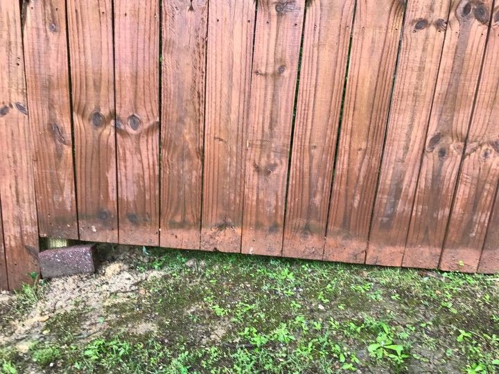 how to cover gaps at bottom of wood fence