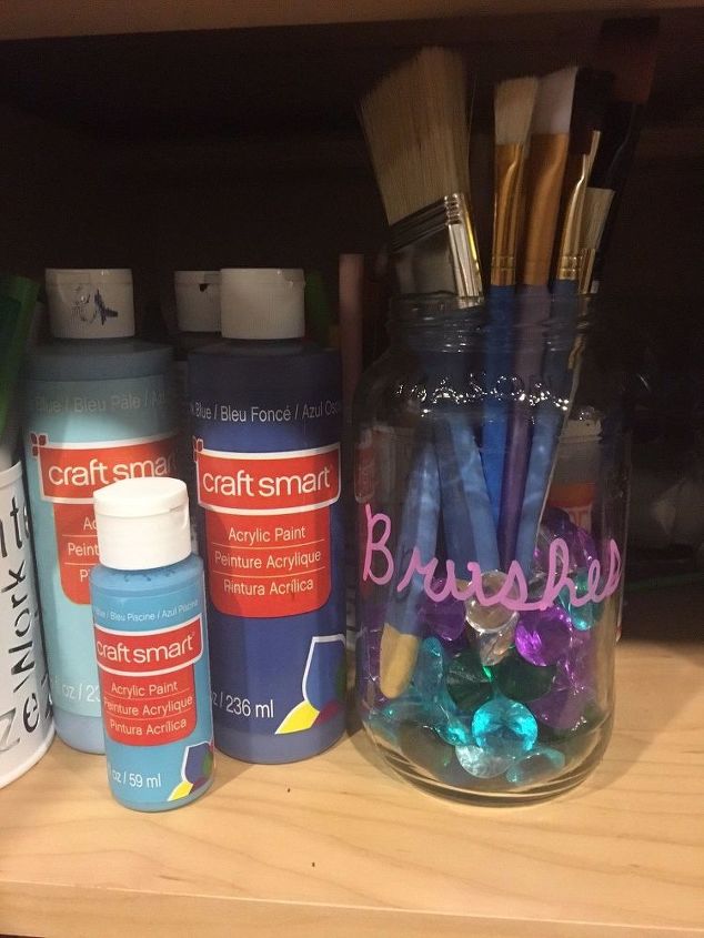 s 9 hacks for the life of a paint artist, Repurpose A Can Of Sauce To A Brush Holder