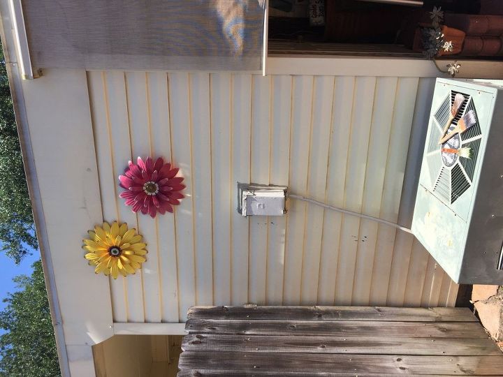 q how can i disguise an air conditioner electrical box on a patio wall