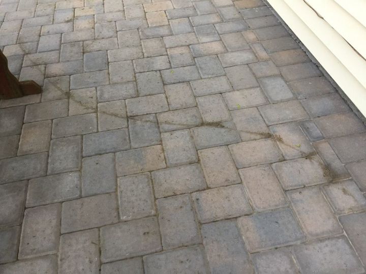 q how do i clean pavers stained by a hose trellis dirt laying on them