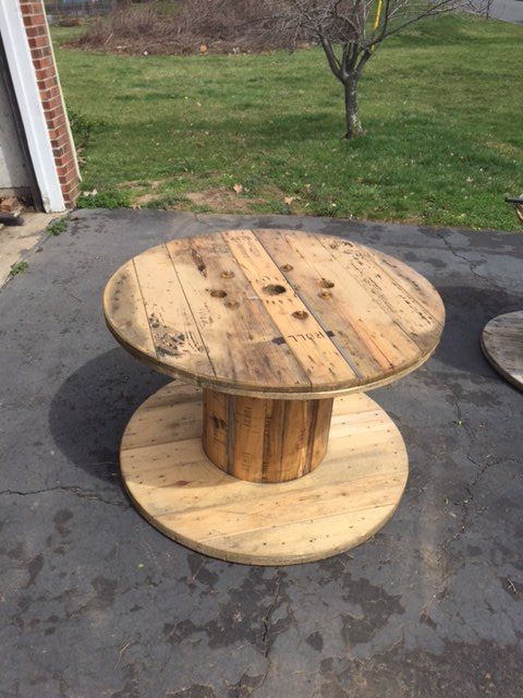up cycled wood spool serving table