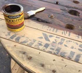 up cycled wood spool serving table