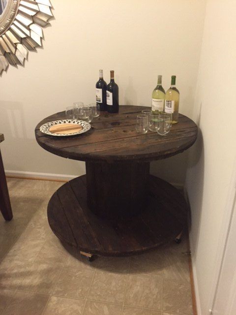 up cycled wood spool serving table