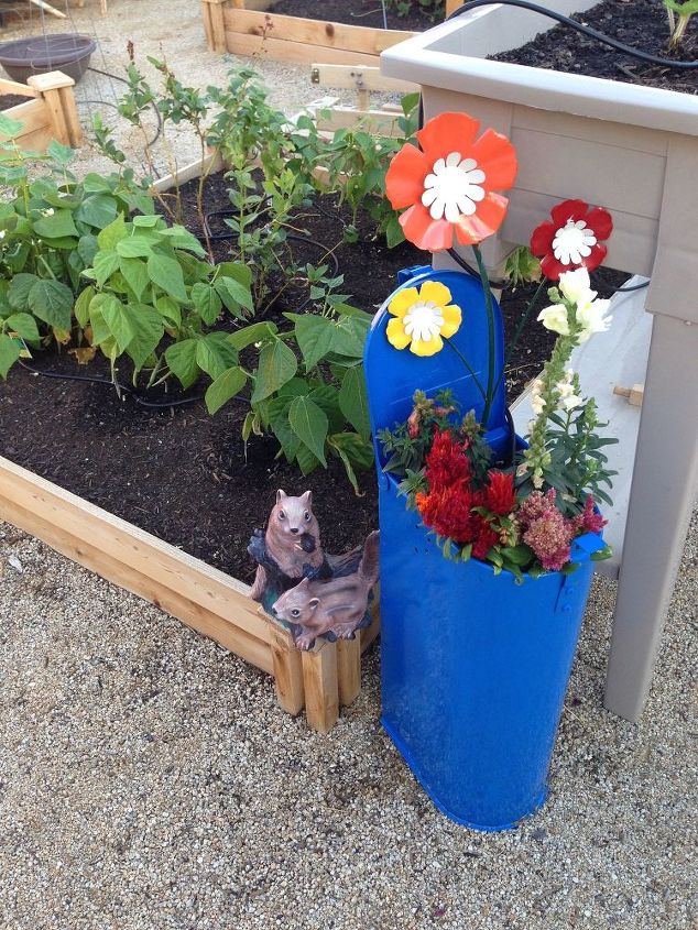 s 30 garden art ideas to fall in love with, Upcycle Wall Pieces With Spray Paint