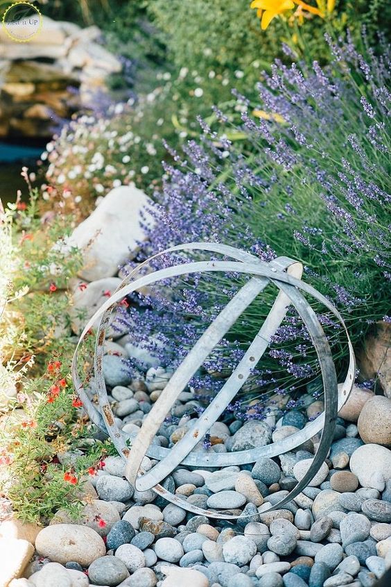 s 30 garden art ideas to fall in love with, Put A Wine Barrel In The Center Of The Garden