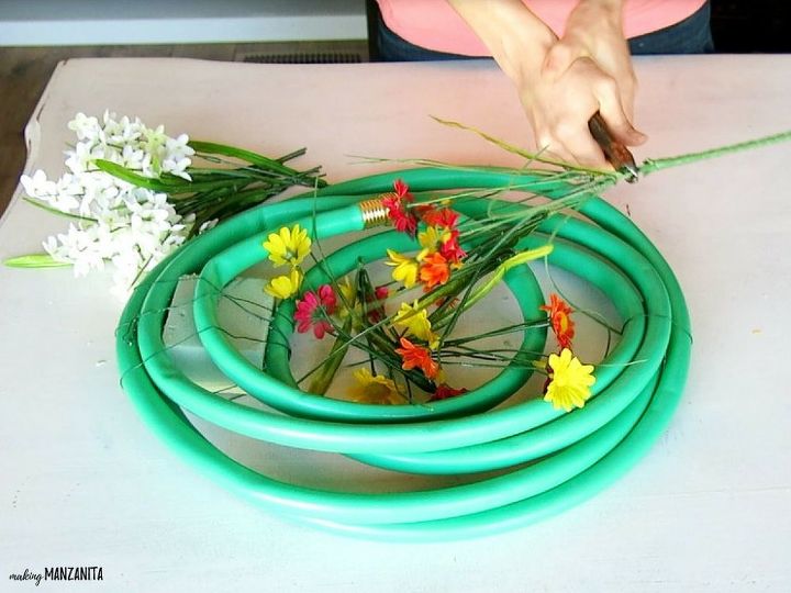 cheerful garden hose wreath perfect for summer