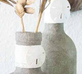 31 coastal decor ideas perfect for your home, Repurpose Bottles Into Vases Coated In Sand