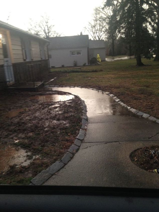 q how can i fix slanted walkway so it won t flood everytime it rains