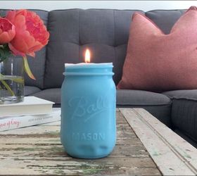 s 10 lovely ways to include mason jars to your home decor, Mold A Pretty Candle For The Coffee Table