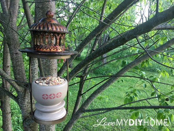 two candle holders become one bird feeder repurpose