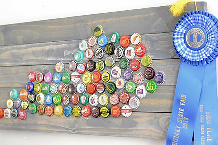 s no way these pops of color were made with dollar store items, This bottle cap art idea