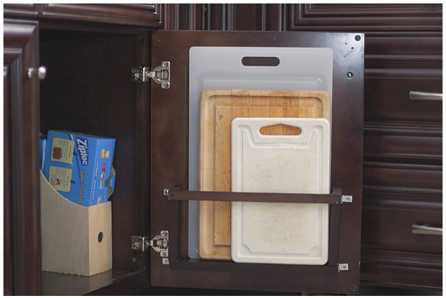 storage hacks that will instantly declutter your kitchen, Store cutting boards on your cabinet door
