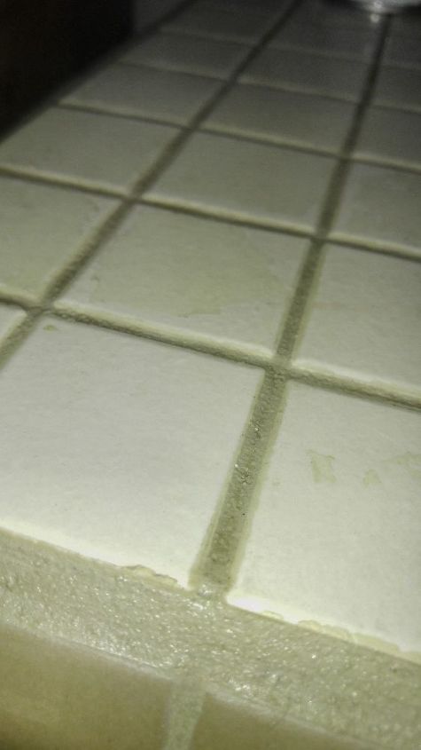 q how to remove grout sealer from tile