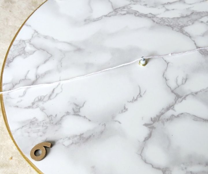 s 31 astounding things you didn t know you could do with contact paper, Create a marble contact paper clock