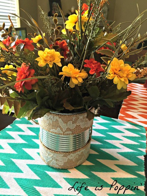 s 15 super affordable ways to decorate for any season, Reuse An Empty Can To Display Flowers