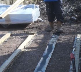 laying a wooden base for a large shed or workshop
