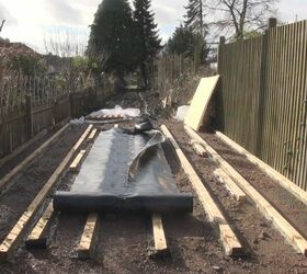 laying a wooden base for a large shed or workshop