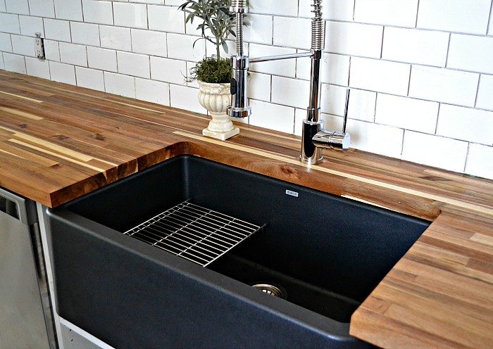 budget kitchen reno featuring a stunning black farmhouse sink