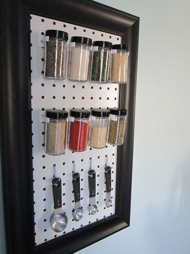 s 15 organizing hacks to help clean up your kitchen, Clamp Your Spices In A Peg Board Rack