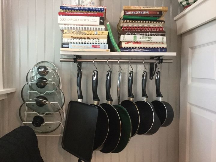 32 space saving storage ideas that ll keep your home organized, Hang your pots and pans on a rod