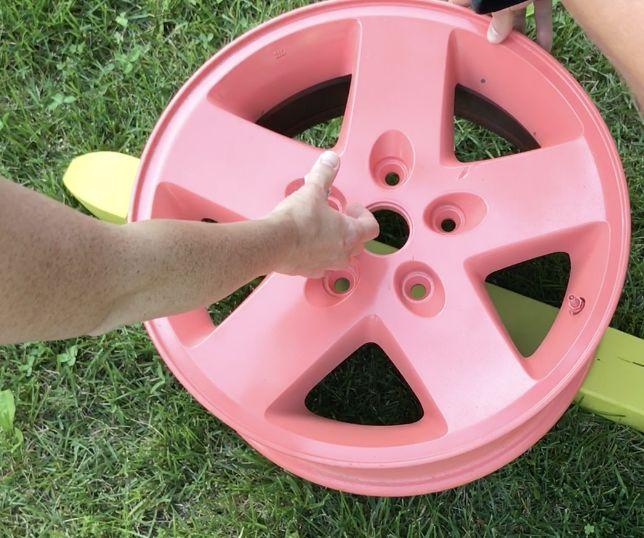 tire rim water hose holder