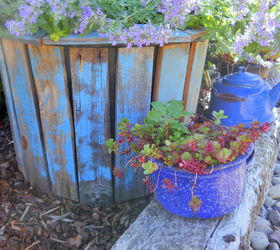 s 15 spunky ways to transform your boring af planters, Cover Up A Planter With Distressed Pallets