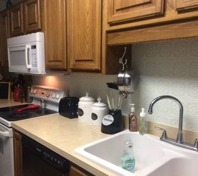 s 31 update ideas to make your kitchen look fabulous, Use textured wallpaper for a cool backsplash