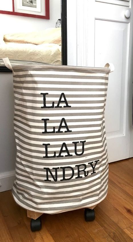 31 space saving storage ideas that ll keep your home organized, Build A Rolling Laundry Basket With A Barrel