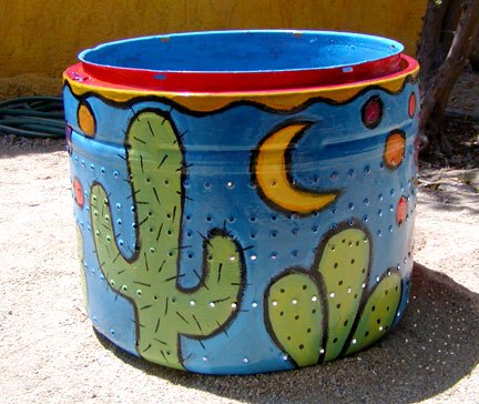 recycled washing machine drum into garden art