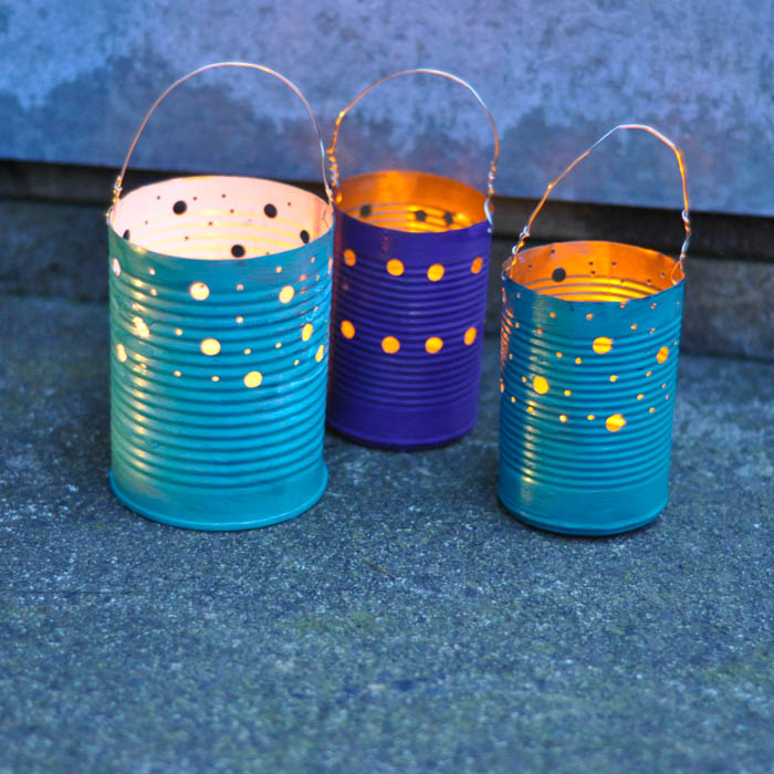 s save your old cans for these 30 home decor ideas, Hang them on trees for a nice ambience