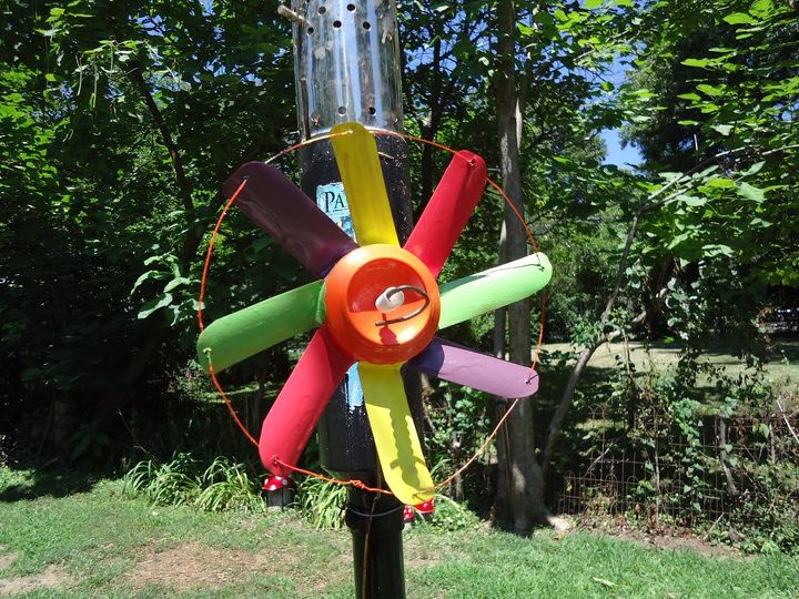 s save your old cans for these 30 home decor ideas, Turn them into colorful wind spinners