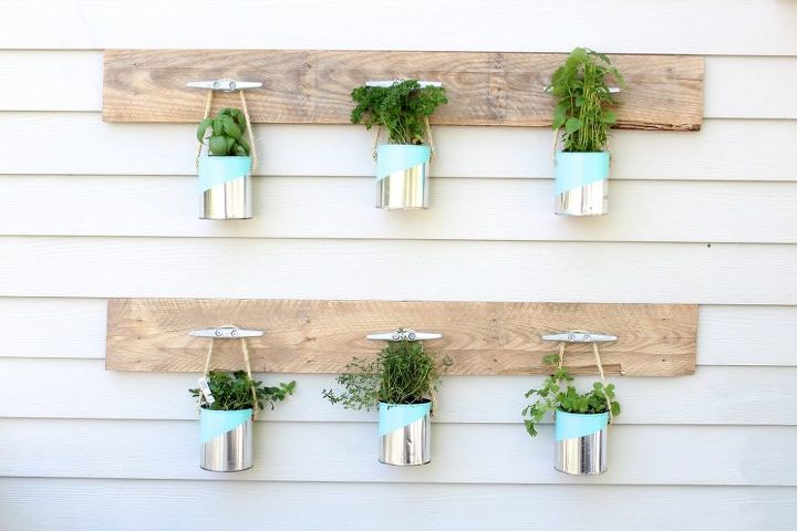 s save your old cans for these 30 home decor ideas, Use painted cans for a hanging planter