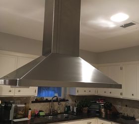 how do i raise a stove vent hood that drops down too low