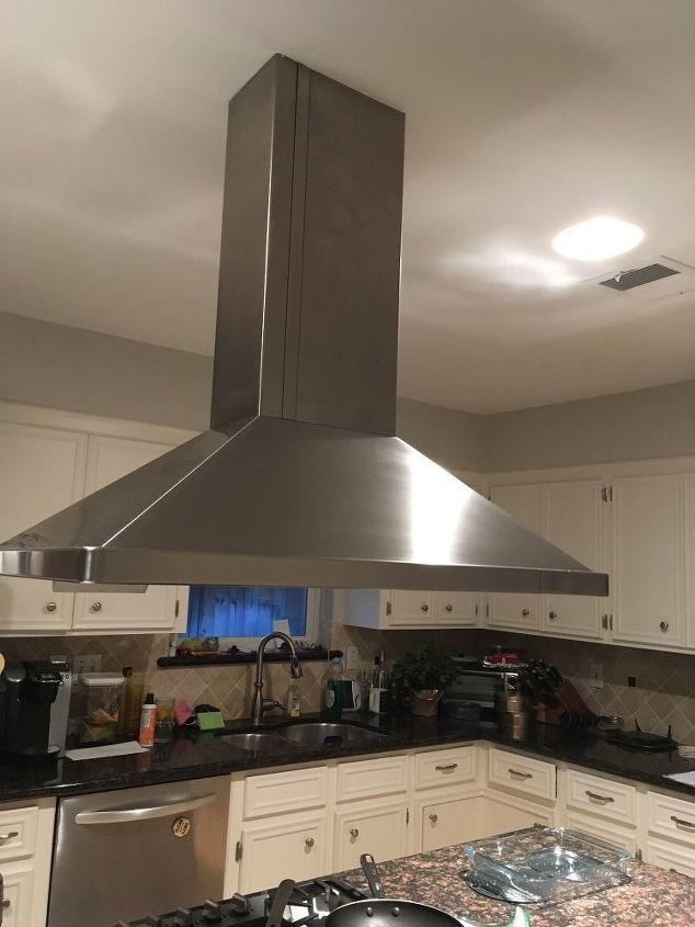 how do i raise a stove vent hood that drops down too low