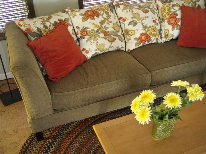 hide your couch s wear and tear with these great ideas, Replace trashed cushions with throw pillows