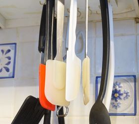 s 31 storage hacks that will instantly declutter your kitchen, Hang your cooking utensils upside down
