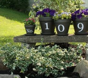 30 address signs that ll make your neighbors stop in admiration, Showcase them across a row of flower pots