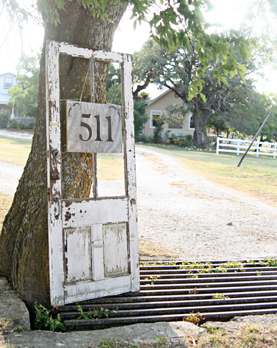 30 address signs that ll make your neighbors stop in admiration, Repurpose an old door for a creative option