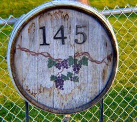 30 address signs that ll make your neighbors stop in admiration, Repurpose a wine barrel bottom