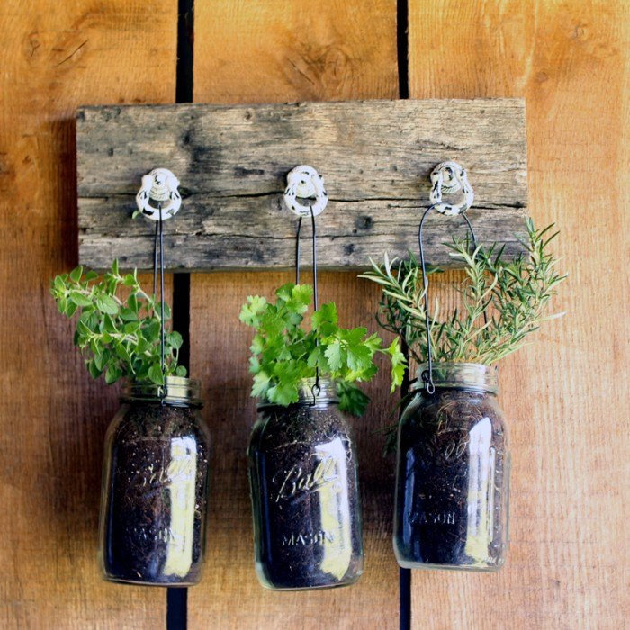 s 10 unique ways to plant your herb garden, Hook Mason Jars Filled With Greenery
