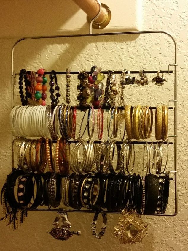 s 32 space saving storage ideas that ll keep your home organized, Organize your jewelry on a pants hanger