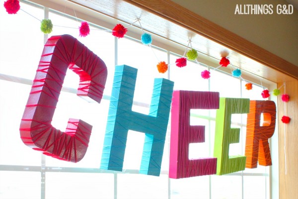 s 15 uncanny hacks for making pretty garland decor, Wrap Yarn Around Forks For Pom Poms