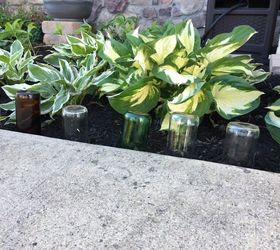 s 10 charming ways to add instant curb appeal to your home, Reuse Empty Bottles For A Garden Border