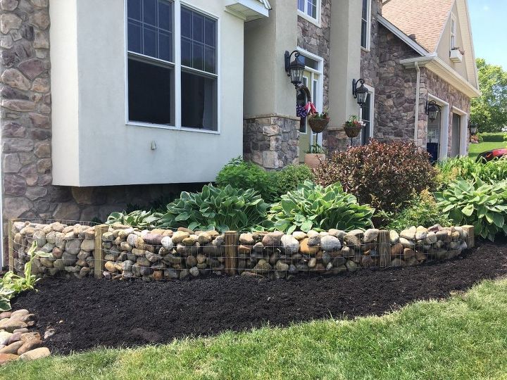 10 maneras encantadoras de aadir un atractivo instantneo a su casa, Muro de piedra para el jard n