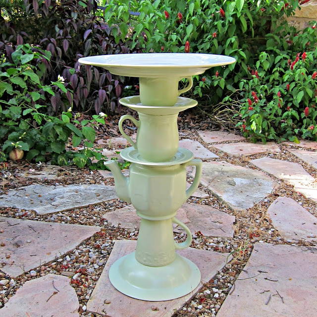 s 30 brilliant things you can make from cheap thrift store finds, Piled dishes to garden totem