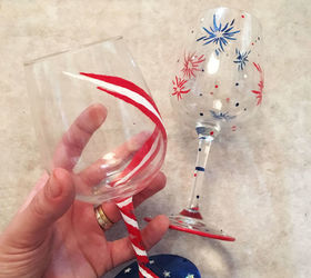 s 30 adorable diy ideas for july 4th, Paint wine glasses with bursts of fireworks