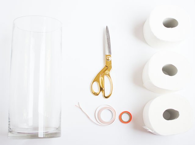 turn a glass vase into chic toilet paper storage