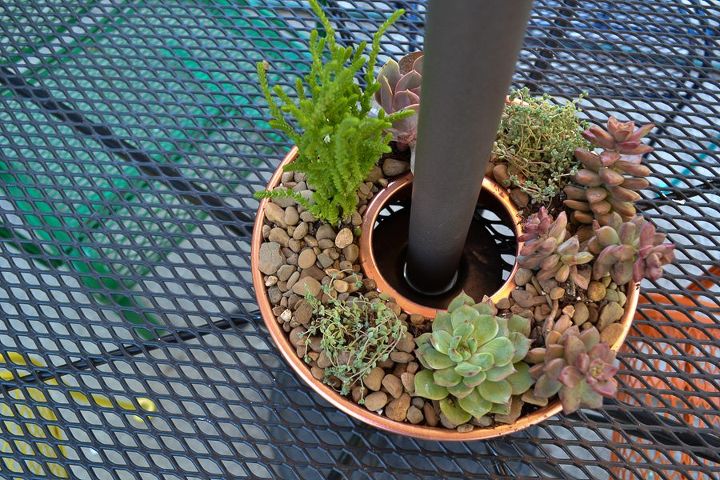 30 neat ideas to upgrade your backyard, Repurpose old copper molds to cool planters
