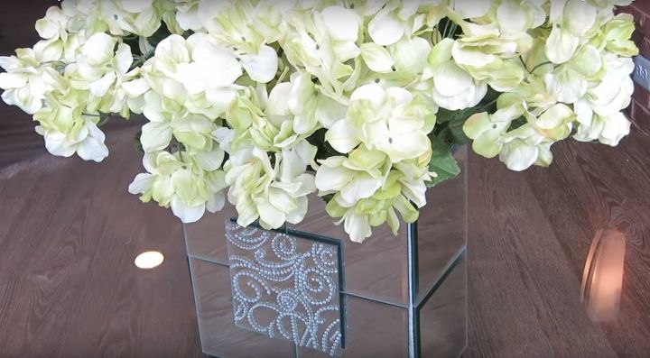 a neat inexpensive way you can make a mirrored flower vase